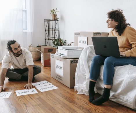 Couple Making Printed Labels For Boxes