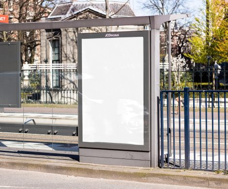 white board on black metal fence