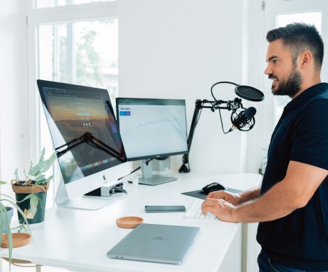 man in black t-shirt sitting at the table